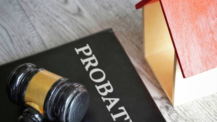 Toy house, gavel and text PROBATE